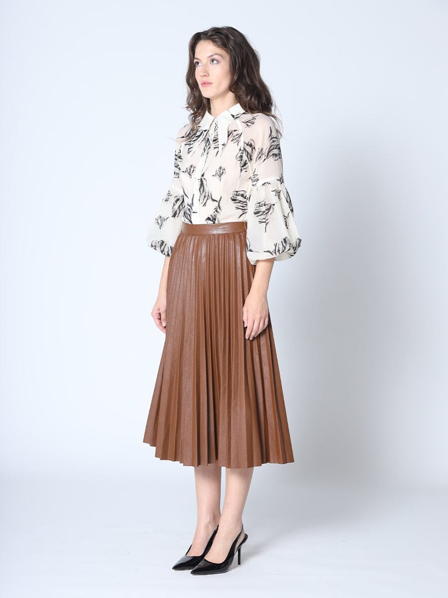 https://www.graciafashion.com/cdn/shop/files/pleated-a-line-midi-length-pleather-skirt-skirt-gracia-fashion-276375_1200x.jpg?v=1700027015